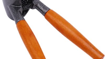 Anwenk heavy duty nutcracker with a round grey textured metal cup, a coiled spring and two orange wooden handles