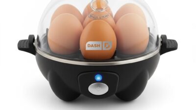 Dash Rapid Egg Cooker in black with trays and measuring cup