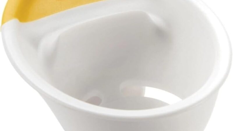 OXO Good Grips 3-in-1 Egg Separator hooked on the edge of a mixing bowl