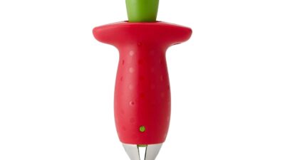 Chef'n strawberry huller shaped like a red strawberry with a green push button and steel claw