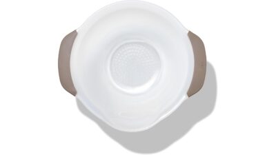 OXO Good Grips rice and grains washing colander, a white bowl with small drain holes, a pour spout and grey handles