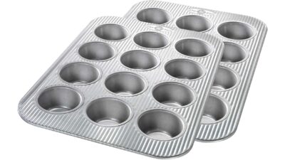 Two USA Pan 12-well aluminised steel muffin pans with a ridged surface