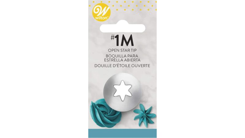 Wilton 1M open star piping tip in its packaging with buttercream swirl examples