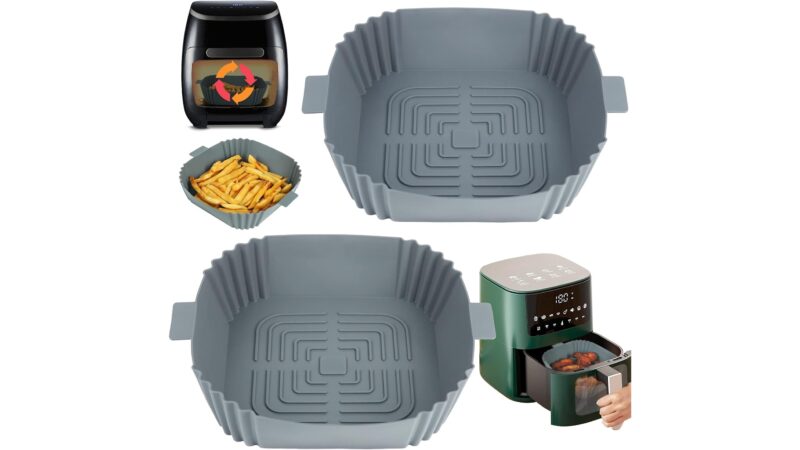 Two grey YQL square silicone air fryer liners with raised ridges on the base, shown in an air fryer basket